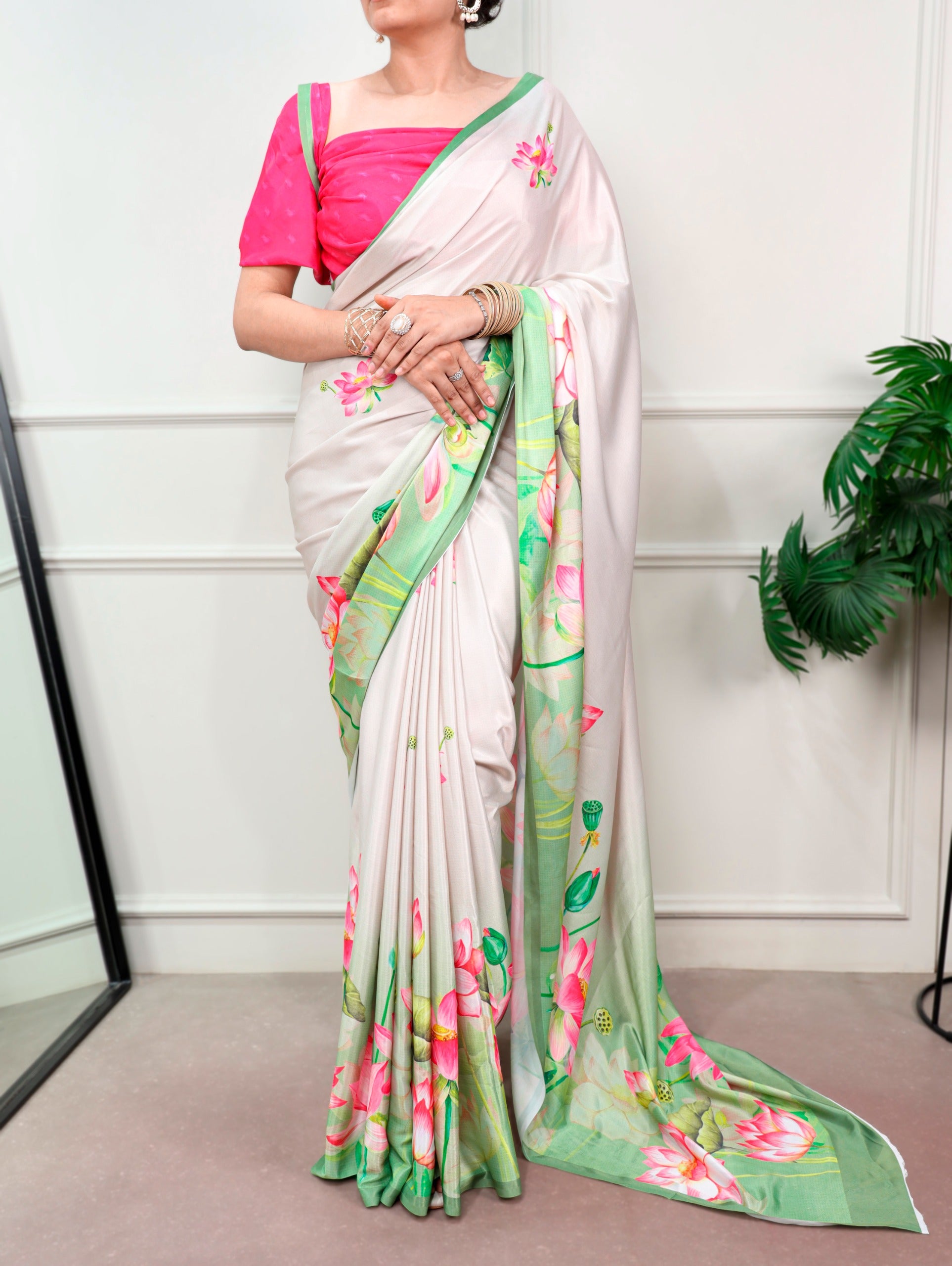 Florals that bloom forever and satin that shines softly—this saree