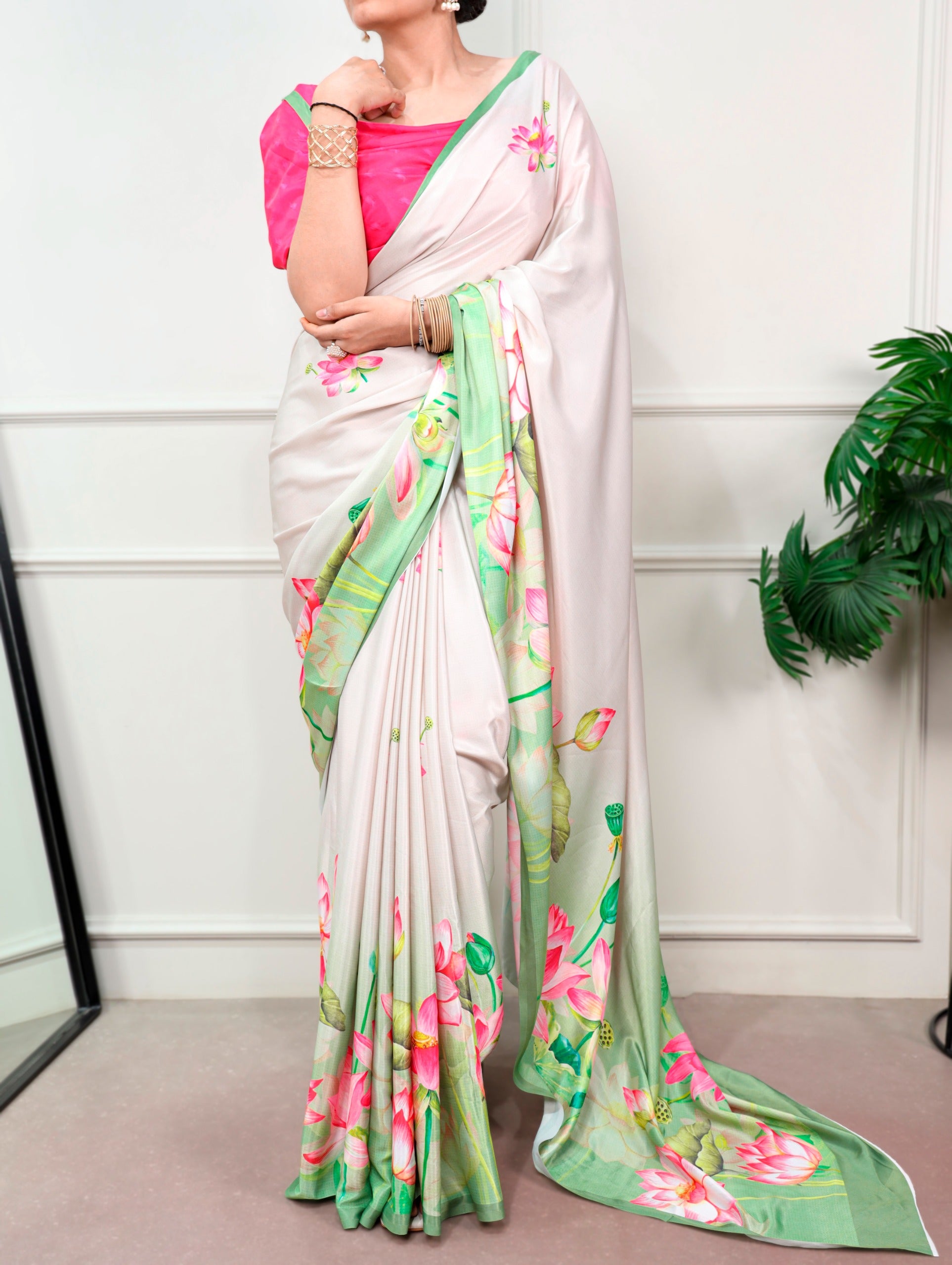 Florals that bloom forever and satin that shines softly—this saree