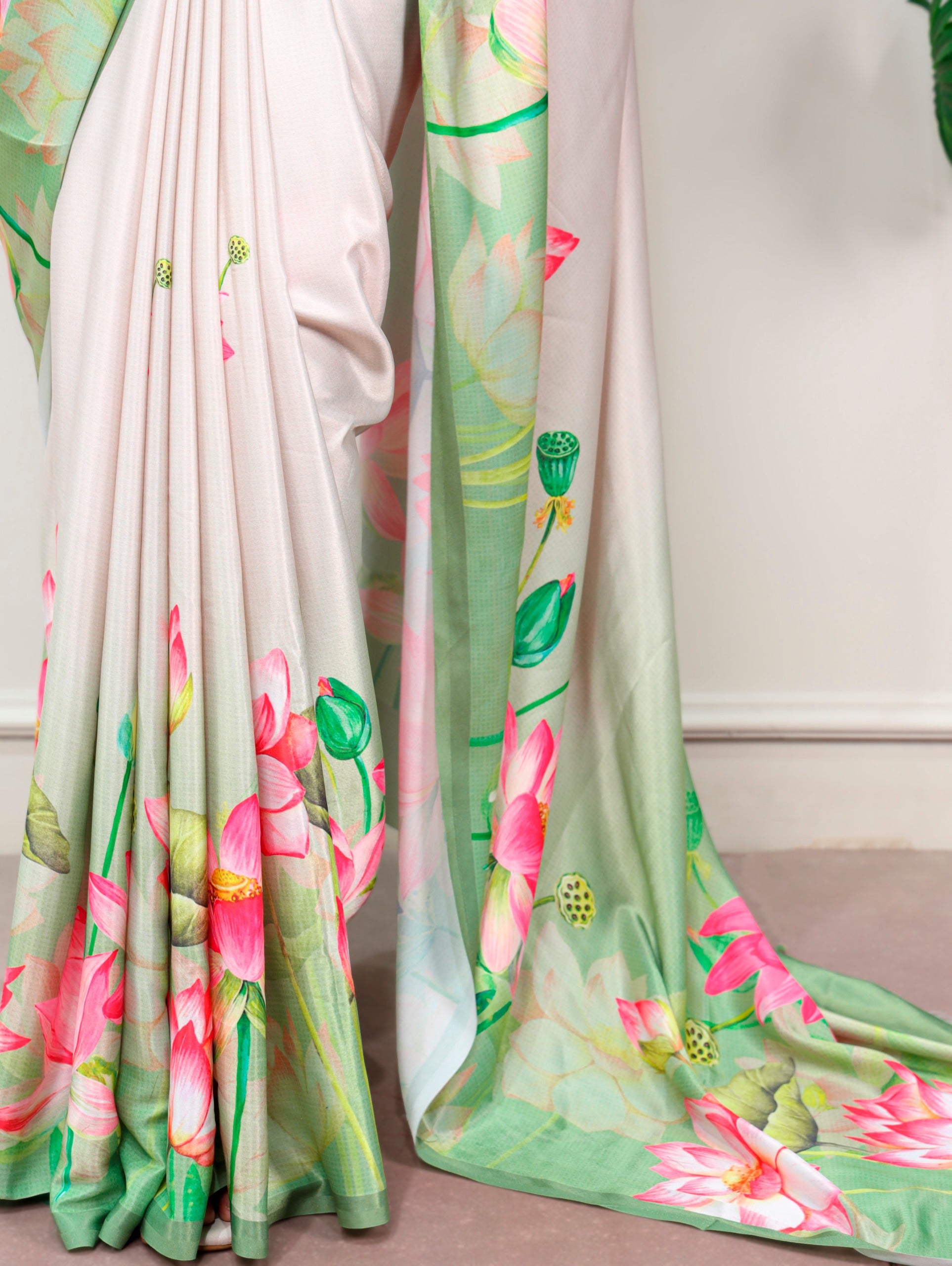 Florals that bloom forever and satin that shines softly—this saree