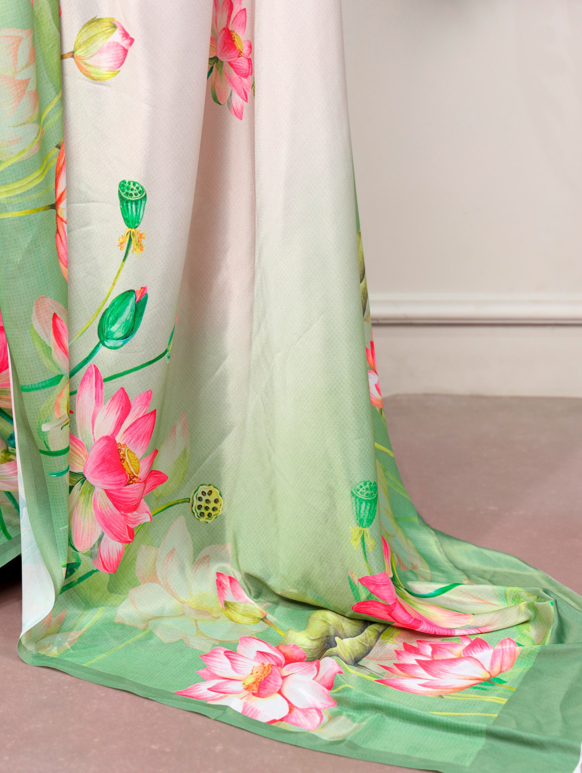 Florals that bloom forever and satin that shines softly—this saree