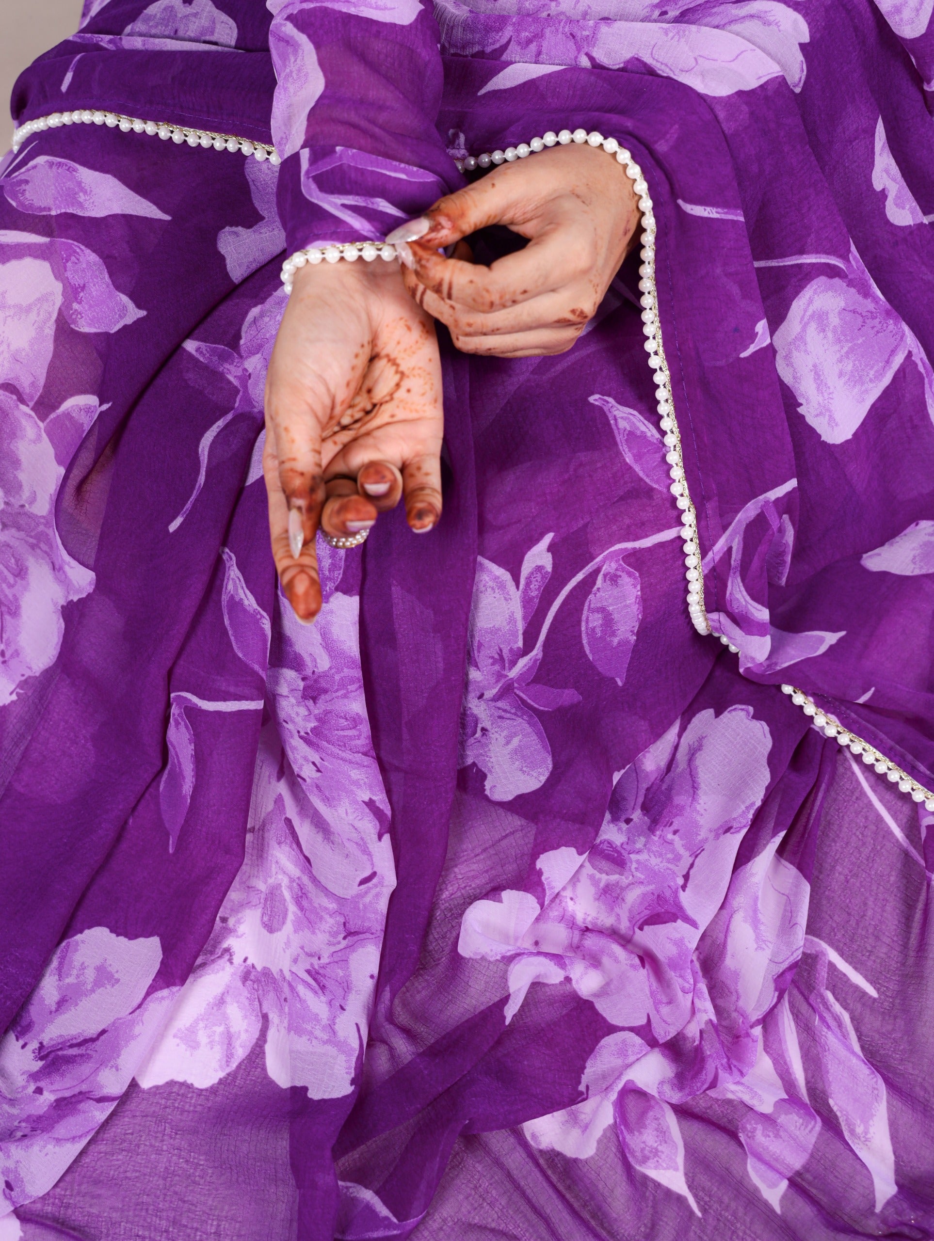 Delicate blooms, pearl border Saree