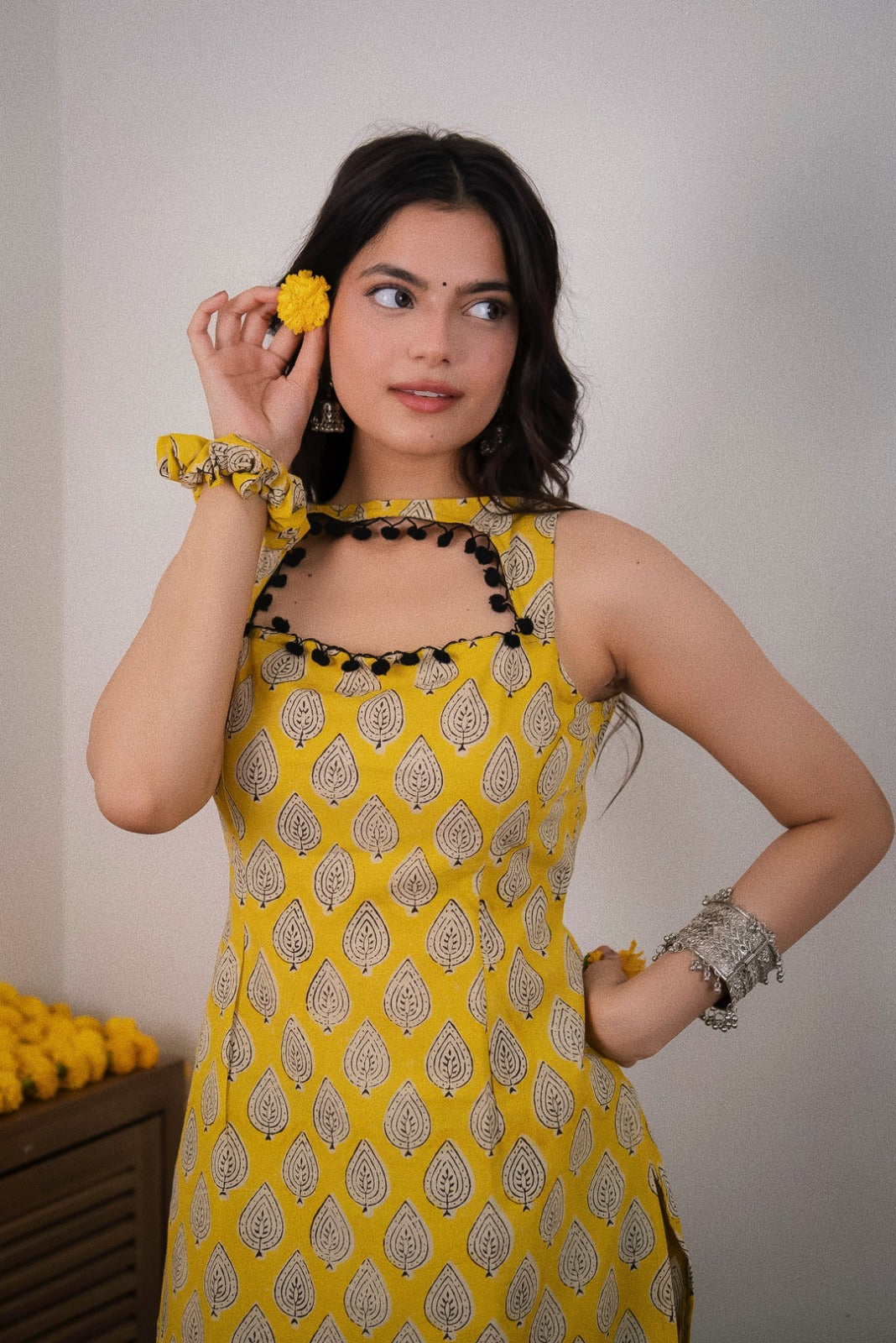 Sonam Yellow Printed  Sleeveless Straight Kurti.