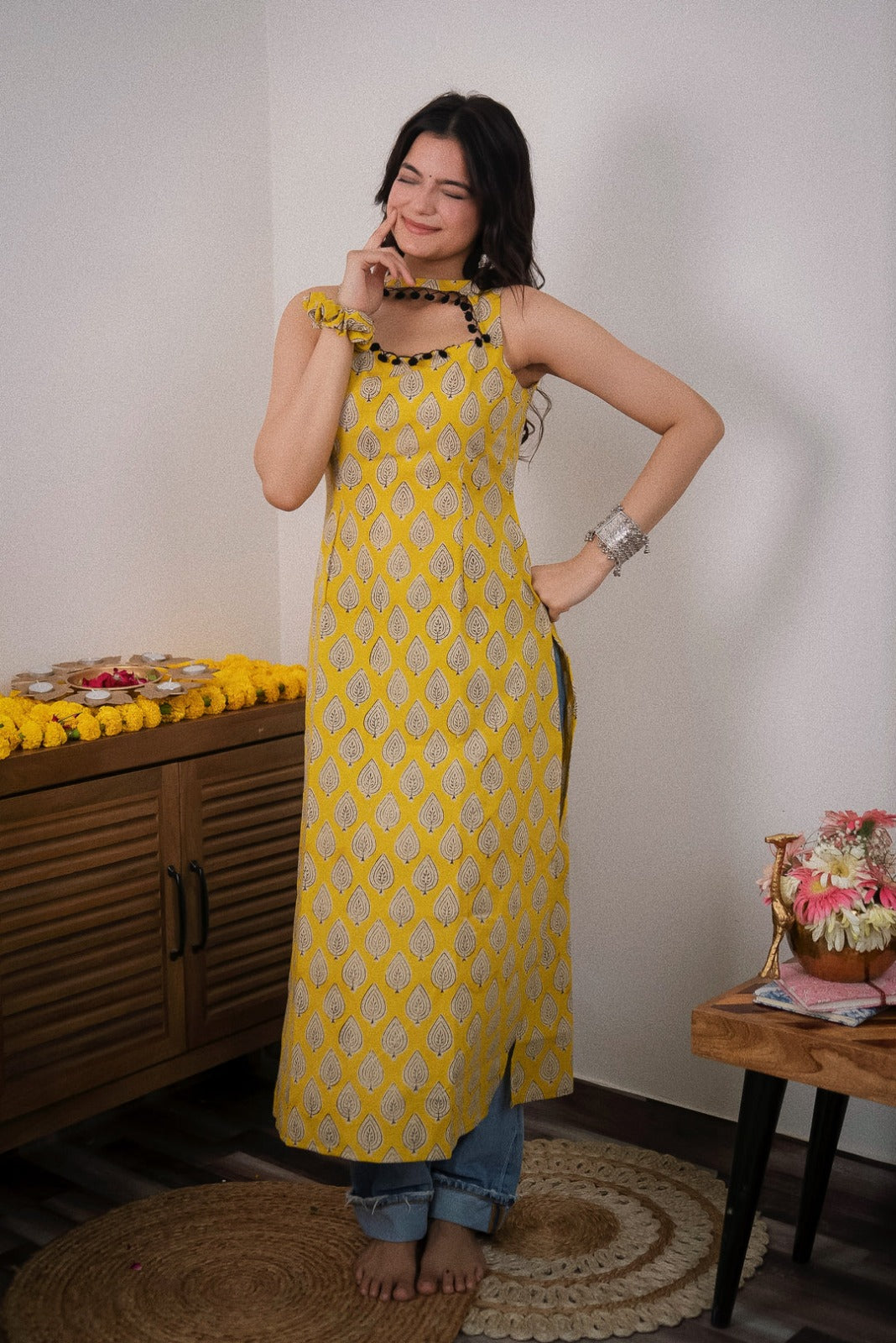 Sonam Yellow Printed  Sleeveless Straight Kurti.