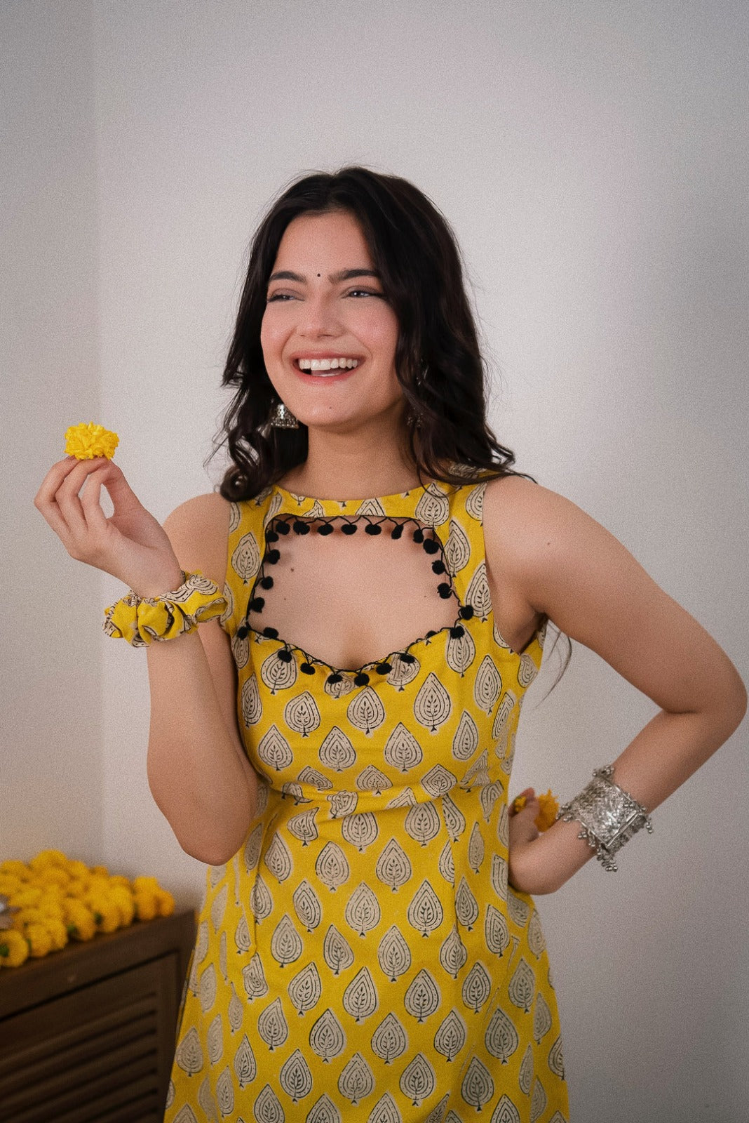Sonam Yellow Printed  Sleeveless Straight Kurti.