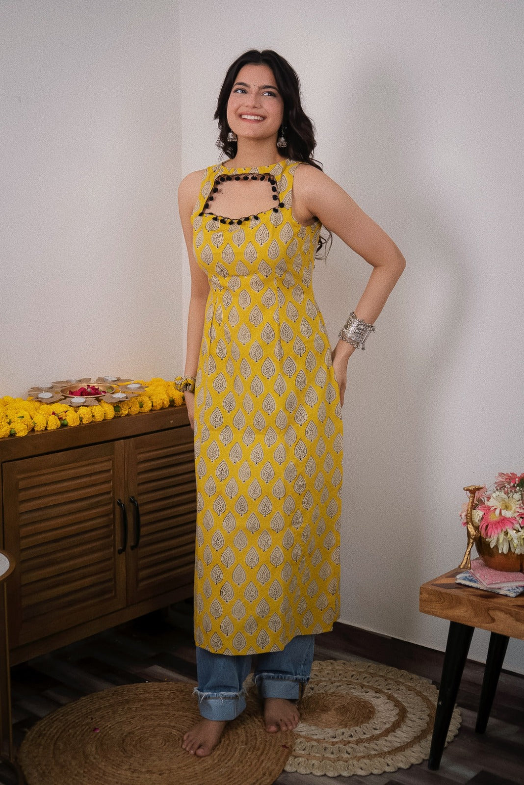 Sonam Yellow Printed  Sleeveless Straight Kurti.